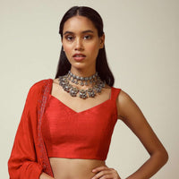 Red Sleeveless Blouse In Raw Silk With V Cut Neckline And Side Zip Closure