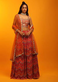 Red And Burnt Orange Lehenga In Georgette With Chevron And Bandhani Print And Mirror Embroidered Choli