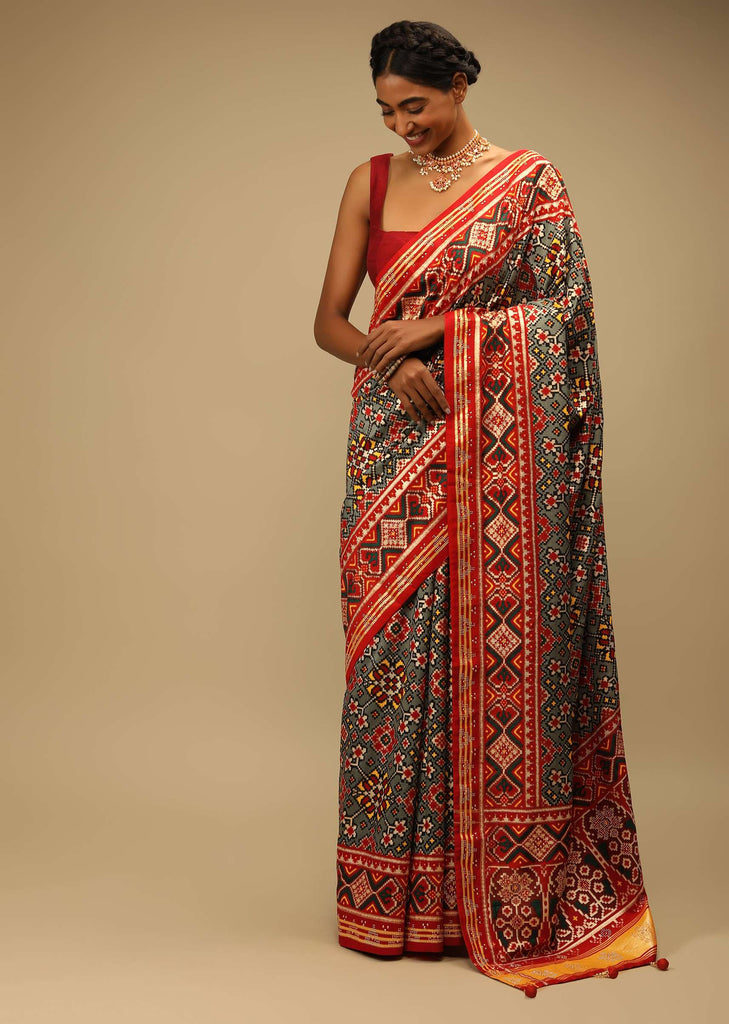 Red And Green Saree In Soft Silk With Patola Print And Stick On Kundan Work