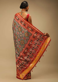 Red And Green Saree In Soft Silk With Patola Print And Stick On Kundan Work