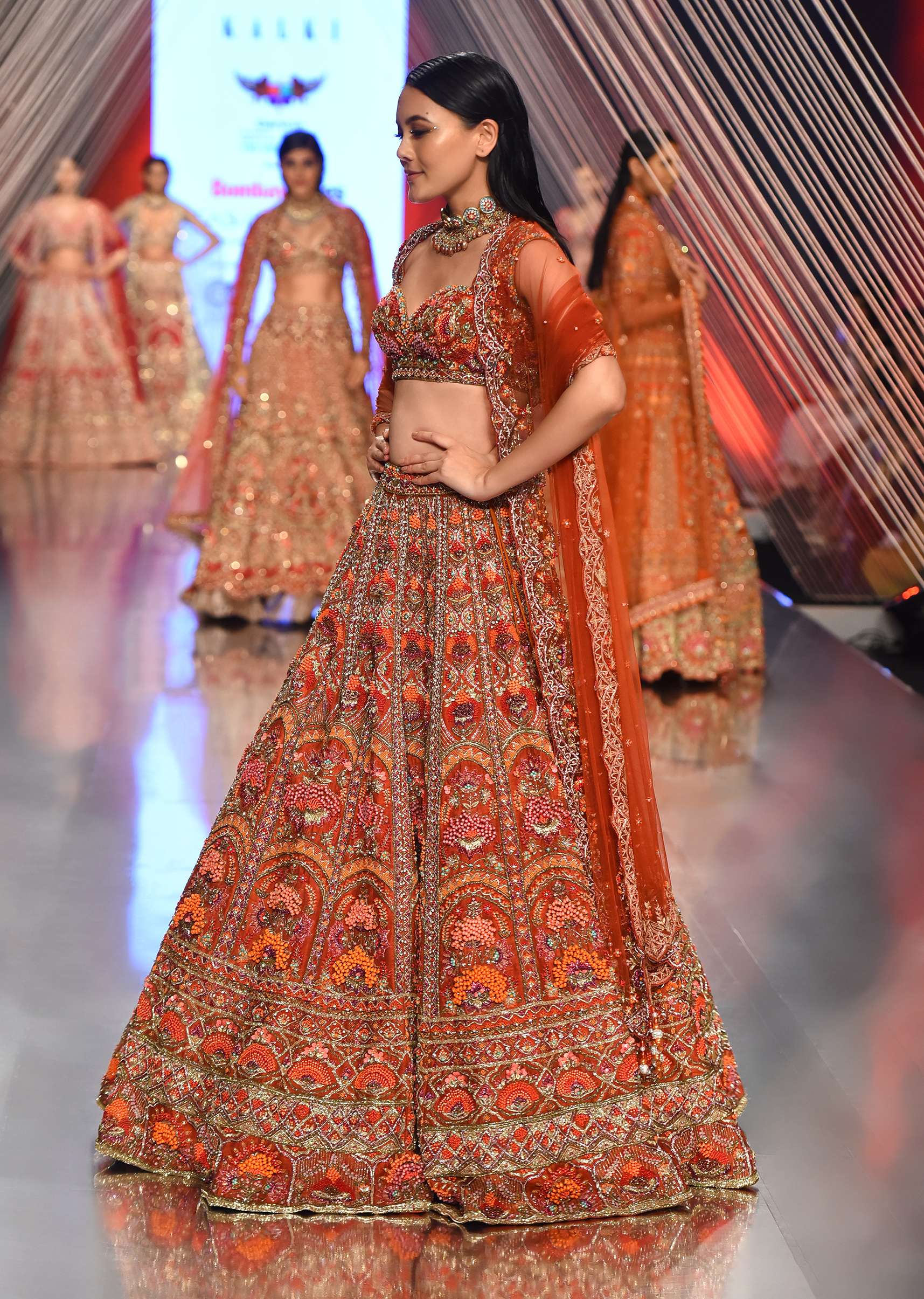 Red Lehenga With A Crop Top In Royal Heritage Embroidery, Crop Top Comes In Sleeveless With A Sweetheart Neckline