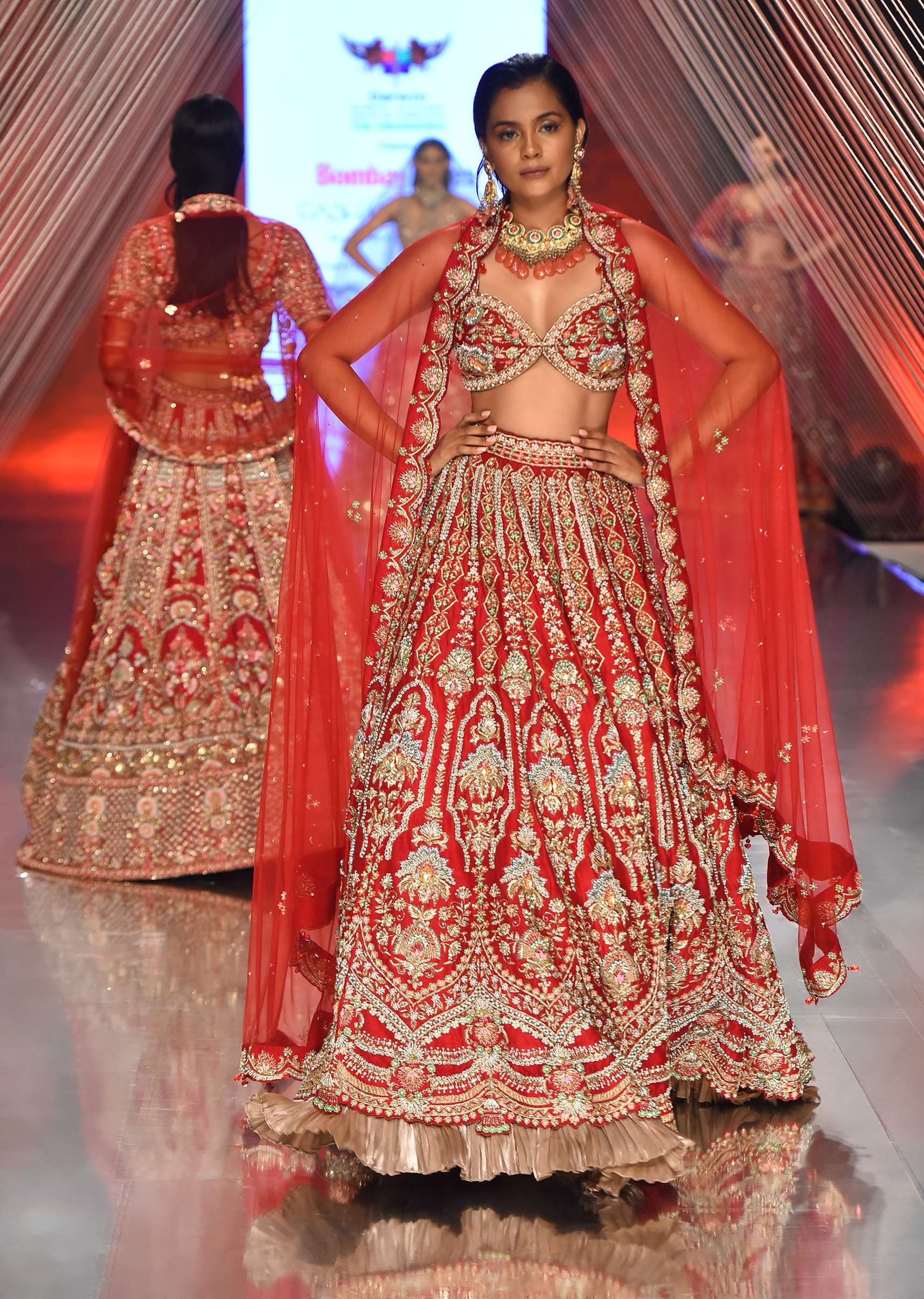 Red Lehenga And A Crop Top In Royal Heritage Embroidery, Bustier Comes In Sleeveless With Back Hooks Closure