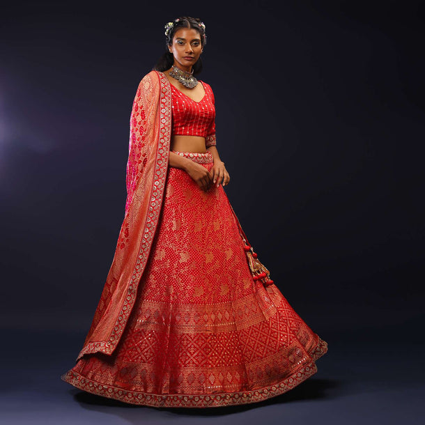 Red Lehenga Choli With Woven Bandhani And Brocade Jaal Along With A Shaded Bandhani Dupatta