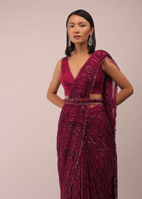 Red Saree With Sequins Work And A Waist Belt Beautified With Stone Tassels