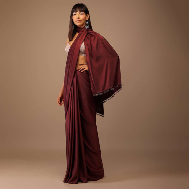 Blood Red Satin Saree With Fringes On The Pallu Paired With Hand Embroidered Bustier