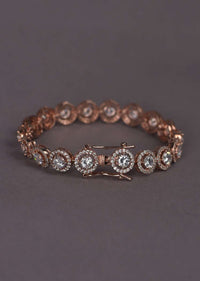 Rose Gold Plated Bracelet With Stones In Concentric Round Design In Chain Pattern Online - Kalki Fashion