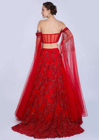 Ruby Red Lehenga In Heavily Embroidered Net With Fancy Off Shoulder Blouse With Long Fared Sleeves