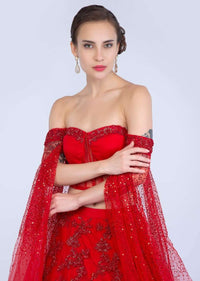 Ruby Red Lehenga In Heavily Embroidered Net With Fancy Off Shoulder Blouse With Long Fared Sleeves