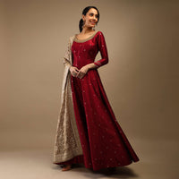 Ruby Wine Anarkali Suit In Raw Silk With Brocade Buttis, Zardosi Embroidered Neckline And Contrasting Gold Brocade Dupatta