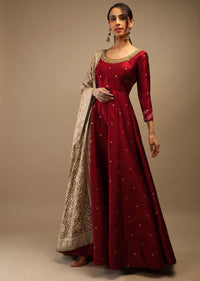 Ruby Wine Anarkali Suit In Raw Silk With Brocade Buttis, Zardosi Embroidered Neckline And Contrasting Gold Brocade Dupatta