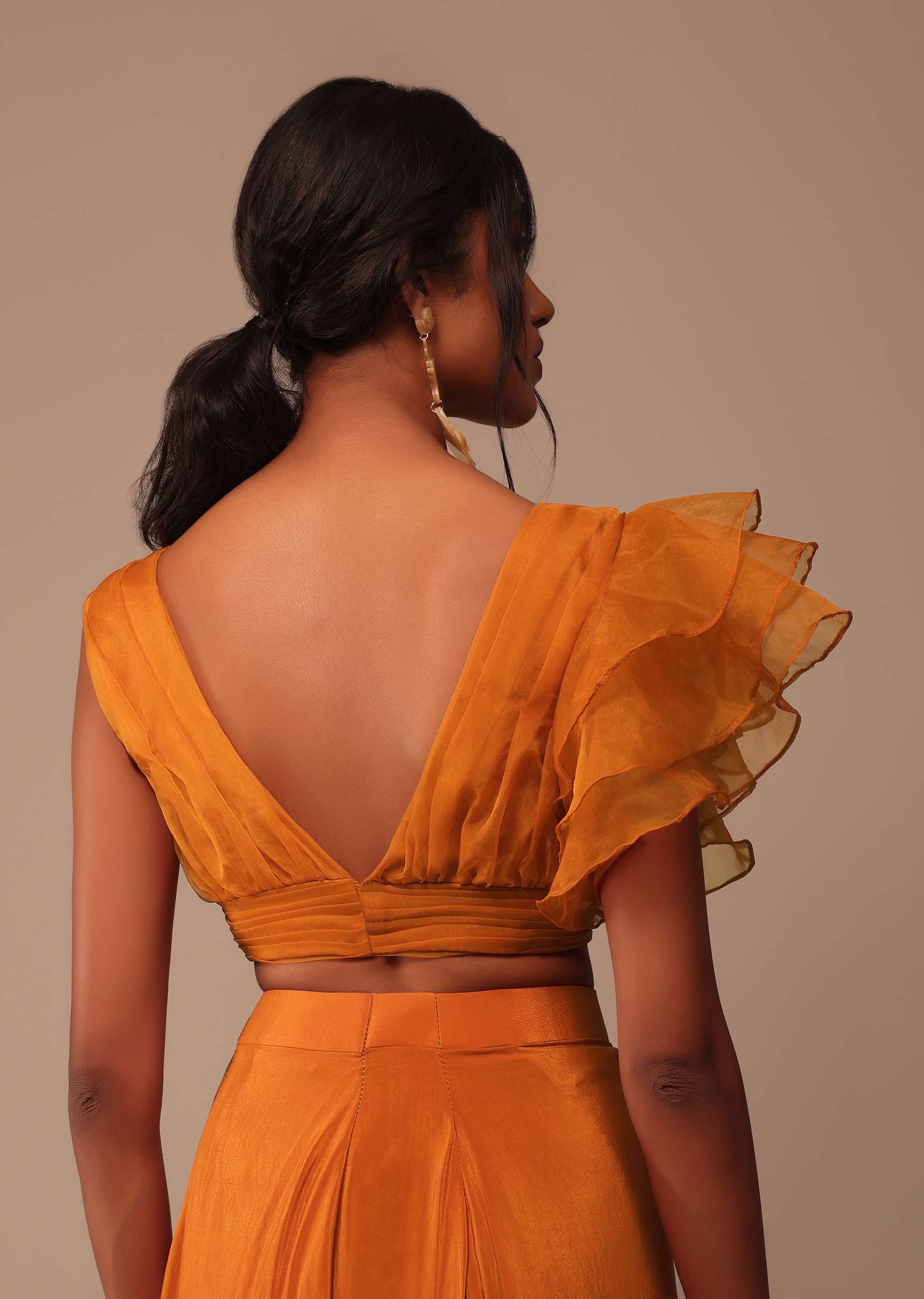 Rust Orange Saree With Fancy Ruffle Blouse And Embroidered Belt