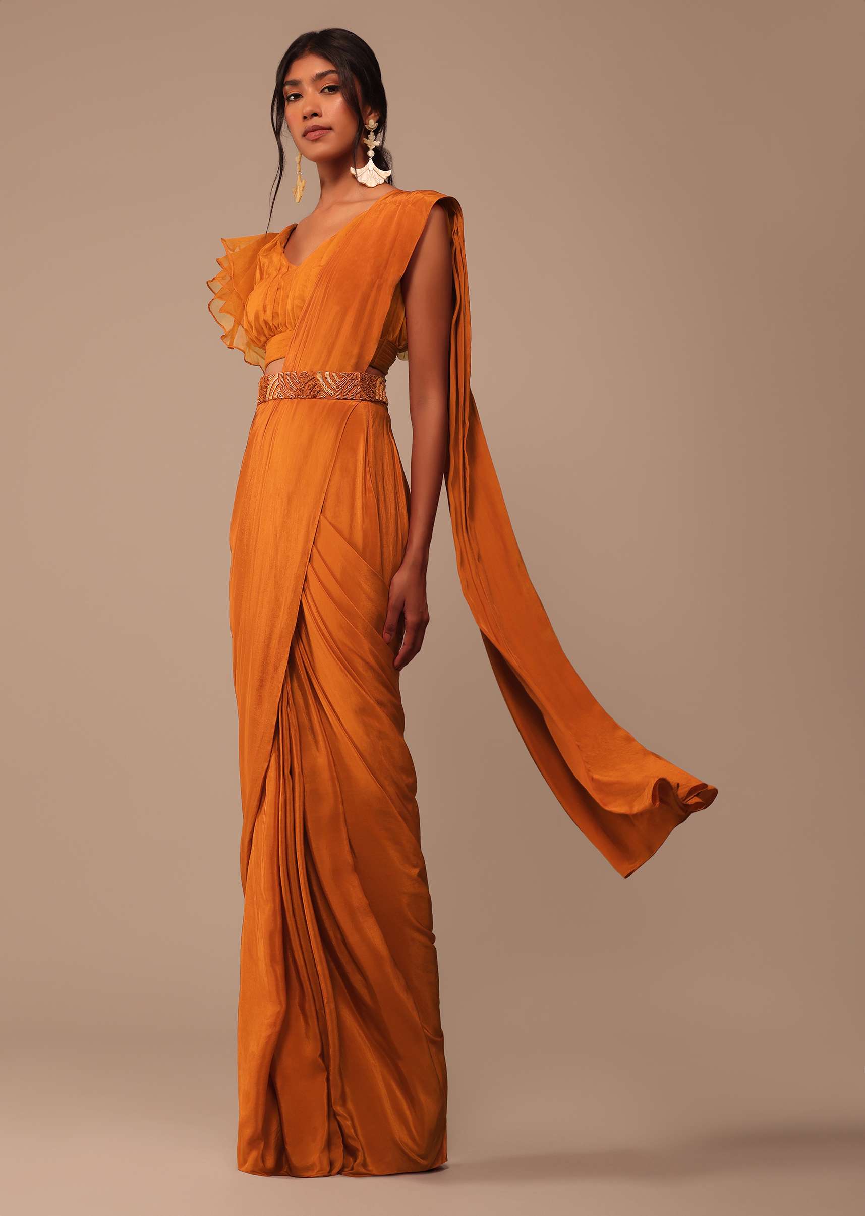 Rust Orange Saree With Fancy Ruffle Blouse And Embroidered Belt
