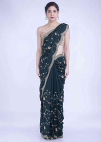 Sacramento green silk saree with matching blouse piece only on Kalki