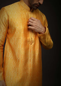 Saffron Yellow Kurta Set In Raw Silk With Tie Dye Design All Over And Resham Work On The Placket