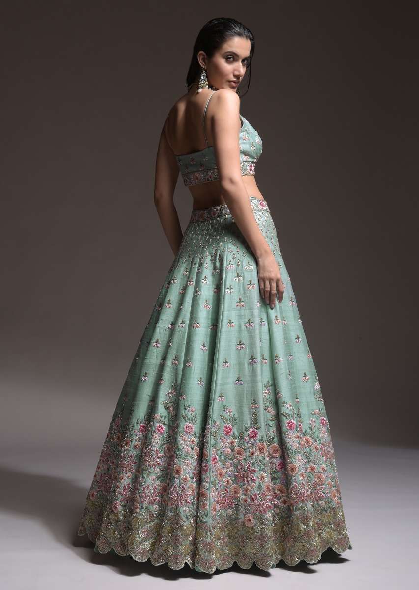 Sage Green Lehenga Choli In Raw Silk With Vibrant Resham Embroidered Cluster Of Summer Blooms And Buttis