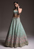 Sage Green Lehenga Choli In Raw Silk With Vibrant Resham Embroidered Cluster Of Summer Blooms And Buttis