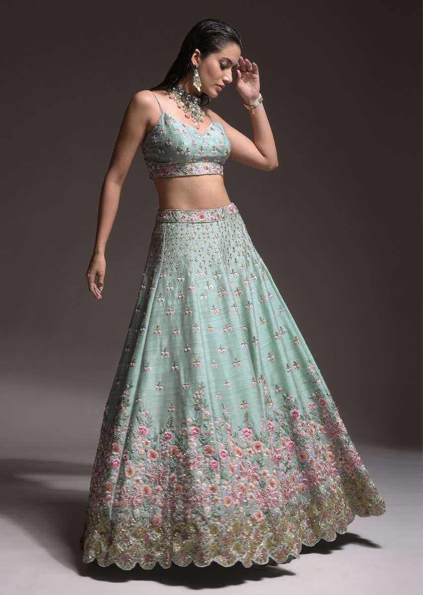 Sage Green Lehenga Choli In Raw Silk With Vibrant Resham Embroidered Cluster Of Summer Blooms And Buttis