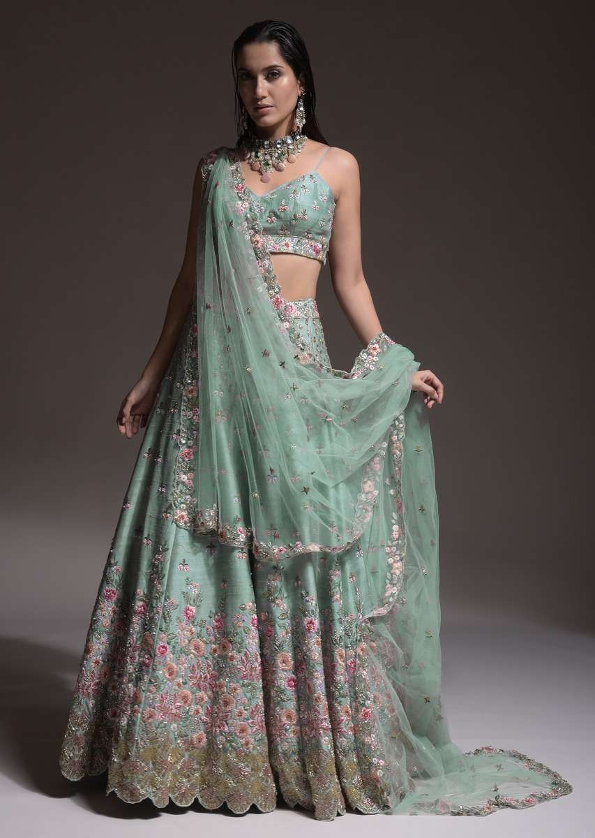 Sage Green Lehenga Choli In Raw Silk With Vibrant Resham Embroidered Cluster Of Summer Blooms And Buttis