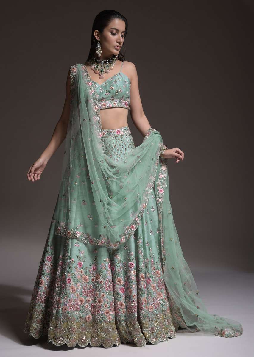 Sage Green Lehenga Choli In Raw Silk With Vibrant Resham Embroidered Cluster Of Summer Blooms And Buttis