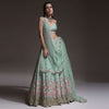 Sage Green Lehenga Choli In Raw Silk With Vibrant Resham Embroidered Cluster Of Summer Blooms And Buttis