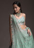 Sage Green Lehenga Choli In Raw Silk With Vibrant Resham Embroidered Cluster Of Summer Blooms And Buttis