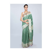 Sage green tussar silk saree with thread embroidered butti and batik print only on kalki