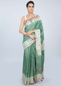 Sage green tussar silk saree with thread embroidered butti and batik print only on kalki