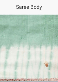 Sage green tussar silk saree with thread embroidered butti and batik print only on kalki