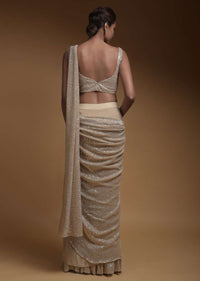 Sand Beige Ready Pleated Saree In Crepe With An Attached Pallu Embellished In Sequins And Ruffle Hem Online - Kalki Fashion