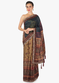 Saree in rust and brown shade with flroal print with fancy tassel only on Kalki