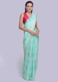 Sea green dola silk saree in silver and golden weaved butti only on Kalki