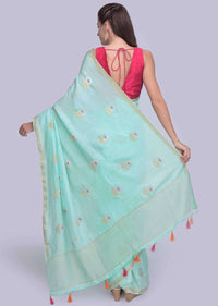 Sea green dola silk saree in silver and golden weaved butti only on Kalki