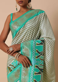 Sea Green Dola Silk Patola Printed Saree With Foil Detail Pallu And Unstitched Blouse Piece