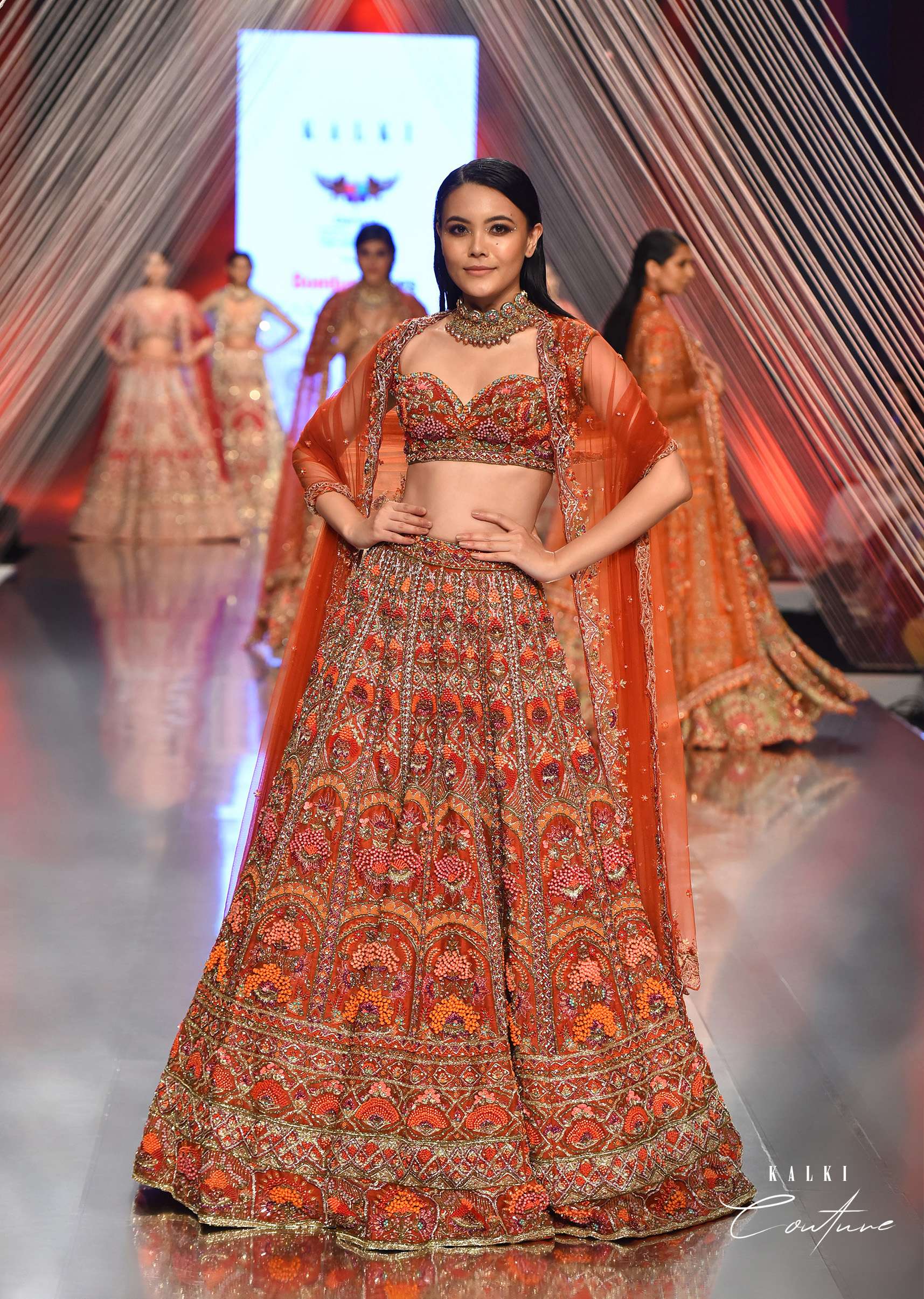 Red Lehenga With A Crop Top In Royal Heritage Embroidery, Crop Top Comes In Sleeveless With A Sweetheart Neckline