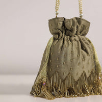 Coffee Brown Potli Bag With Tassels And A Handworked Handle