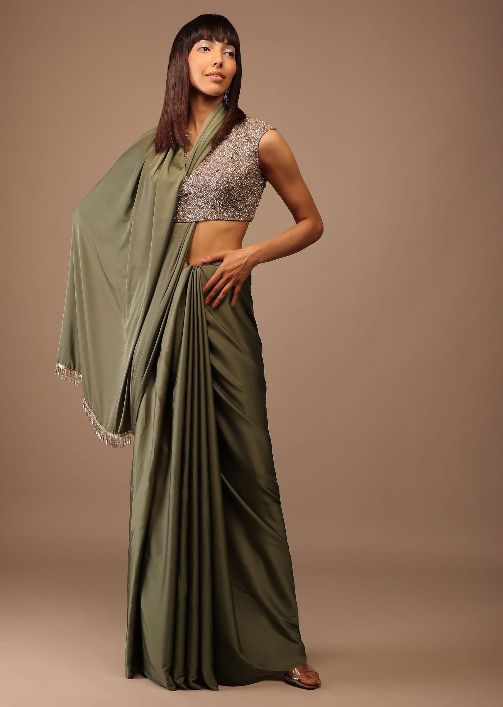 Moss Green Satin Saree With Fringes On Pallu Paired With Deep Neck Hand Embroidered Crop Top