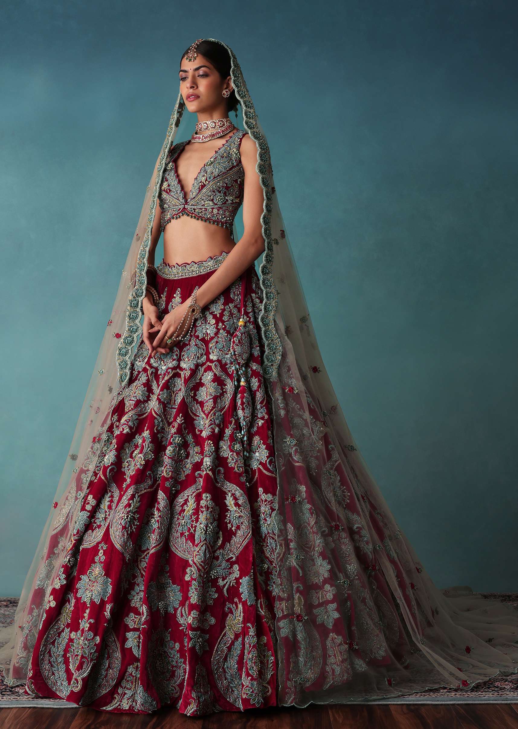 Deep Red Hand Embroidered Bridal Lehenga And blouse Set In Velvet