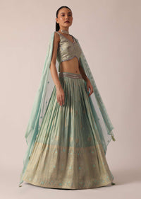 Green Lehenga Set In Brocade Silk With Floral Buttis