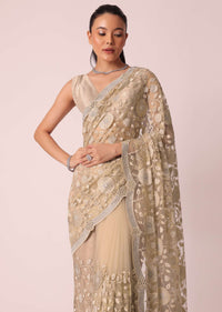 Gold Net Saree With Stone Studded And Florar work And Unstitched Blouse Piece