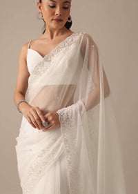 White Organza Saree With Bead Work Border And Unstitched Blouse Piece