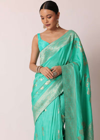 Turquoise Banarasi Saree With Floral Jaal Zari Pallu And Unstitched Blouse Piece