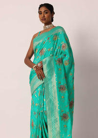 Teal Saree In Banarasi Silk With Floral Motifs And Unstitched Blouse Piece