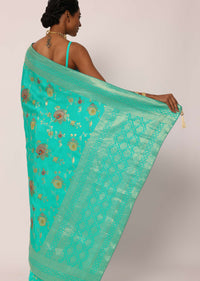 Teal Saree In Banarasi Silk With Floral Motifs And Unstitched Blouse Piece