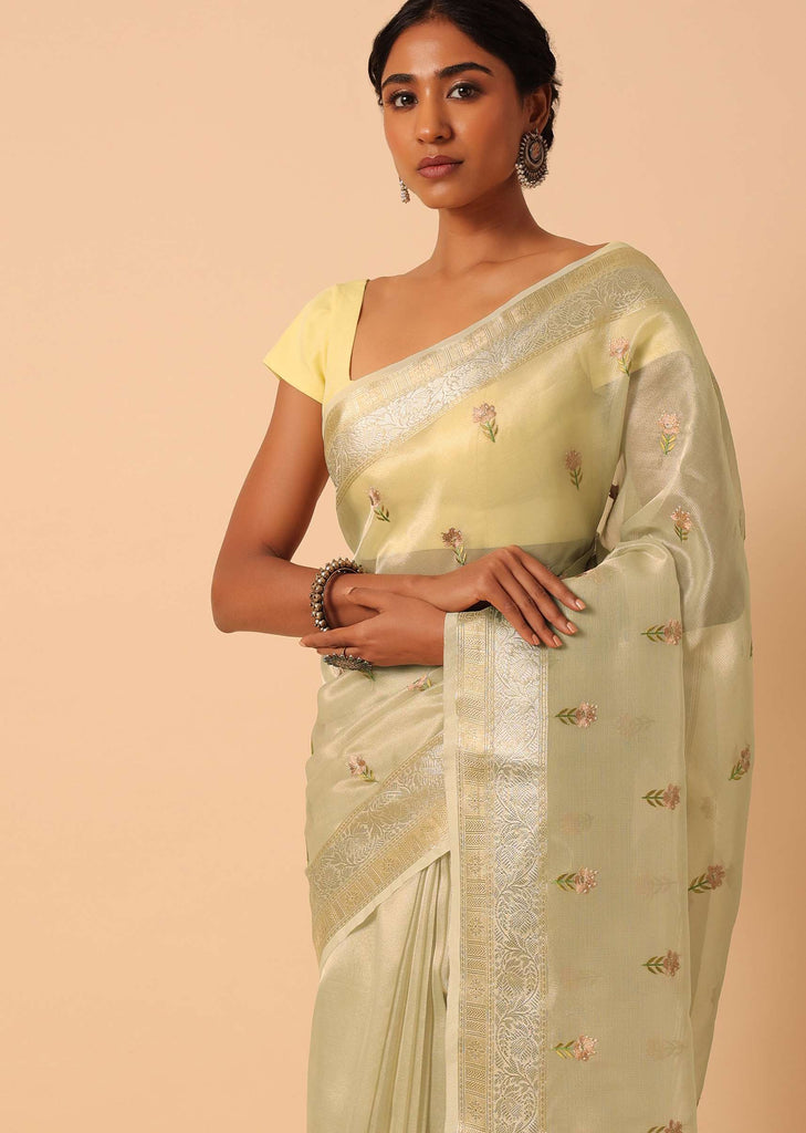 White Kora Silk Woven Saree With Floral Motif Work And Unstitched Blouse Piece