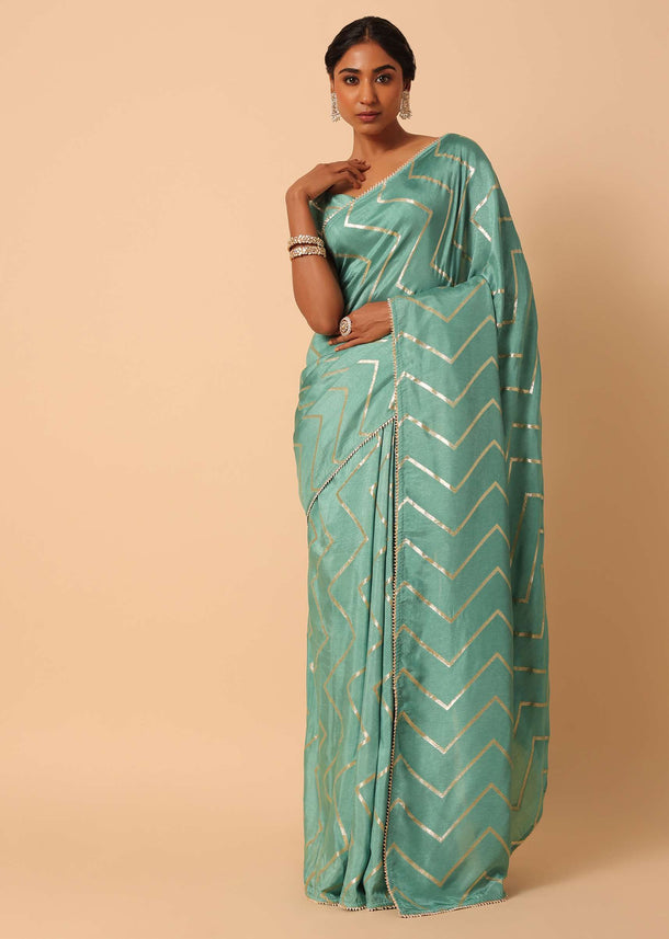 Green Dola Silk Saree With Zig Zag Lurex Work And Unstitched Blouse Piece