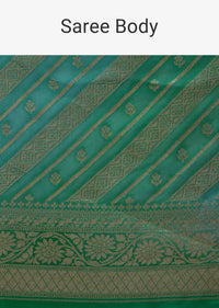 Shaded Green georgette saree with weaved work in stripes and floral butti