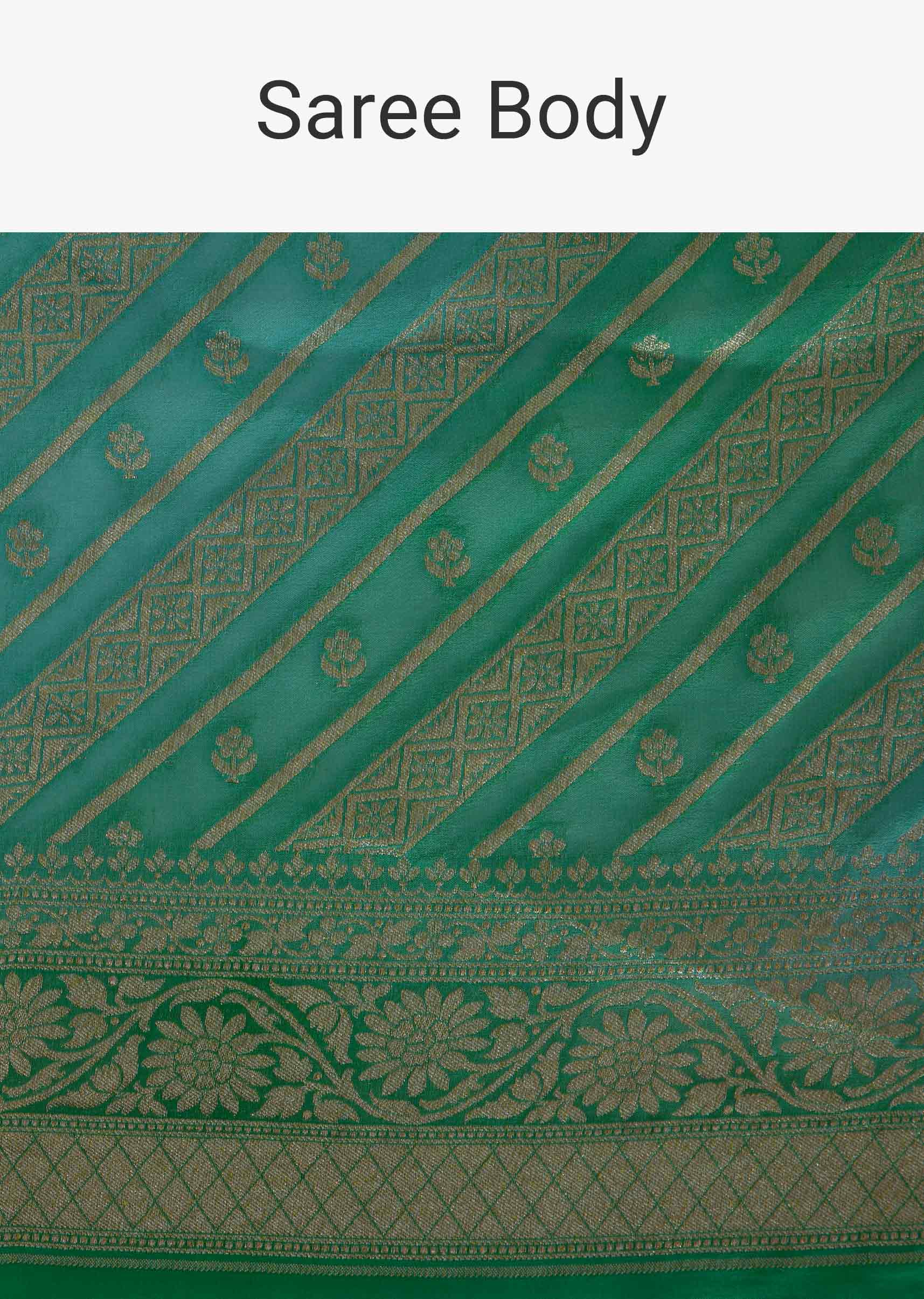 Shaded Green georgette saree with weaved work in stripes and floral butti