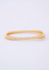 Shiny gold plated bracelet with stone studded edges only on Kalki