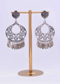 Silver coated dangler earring with floral cut work only on Kalki