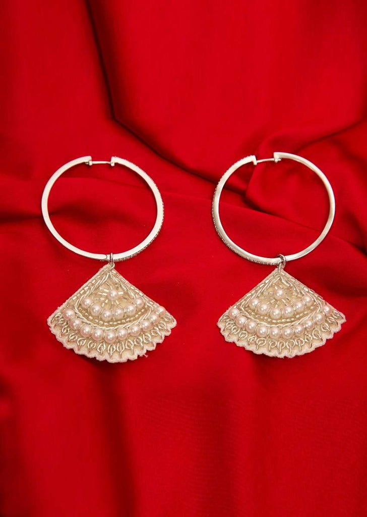 Silver hoop earring with a fabric based drops